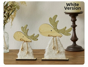 Detail of creative wooden reindeer tabletop ornaments with white fur and golden antlers