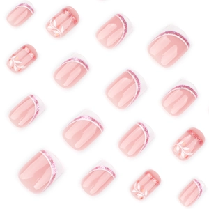 Short square press on nails with nude pink French tips and white leaf patterns