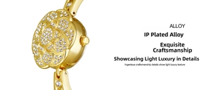 Macro shot of gold IP plated alloy watch featuring rhinestone camellia flower details