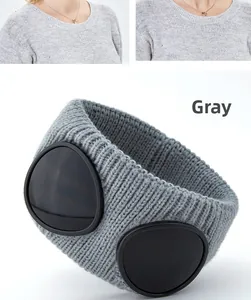 Detail of grey ribbed knit headband featuring iconic decorative goggles for outdoor winter wear