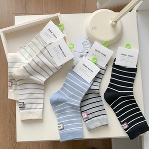 Set of five striped cotton crew socks for women featuring colorful sporty ribbed patterns