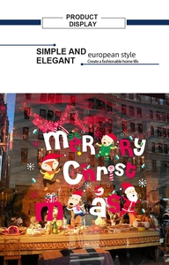 Detail of Christmas window stickers featuring Santa, animals, and snowflakes on glass