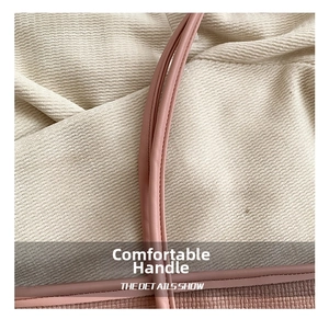 Detail of woven texture and premium stitching on the pink tote bag handle