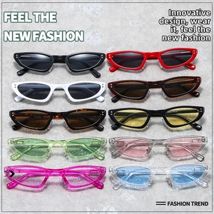 Detailed collection of vintage cat-eye sunglasses in various colors on a stone background