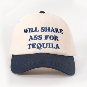 Detail of WILL SHAKE embroidery on two-tone off-white and navy blue baseball cap