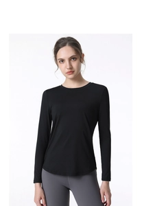Close-up of black breathable yoga top featuring round neck and curved hem for women