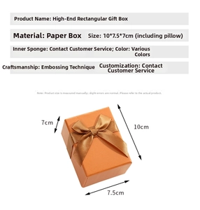 Orange embossed rectangular gift box with brown ribbon bow and detailed dimensions