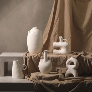 Minimalist white ceramic vase set with organic shapes and matte finish for home decor
