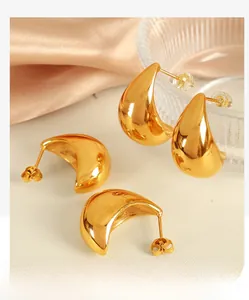 Detailed close-up of 18K gold-plated teardrop earrings with a polished mirror finish