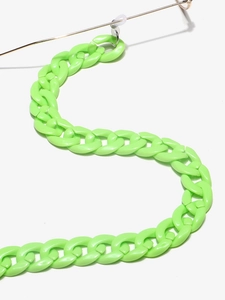 Macro shot of neon green acrylic chain links for eyewear cords on a plain background