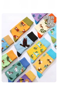 Detail view of cotton crew socks with animal prints and floral patterns in vibrant colors