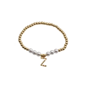 Golden bead and pearl bracelet featuring a colorful zircon inlaid letter Z pendant
