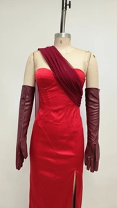 Detail of red satin evening gown with side slit and matching burgundy faux leather gloves