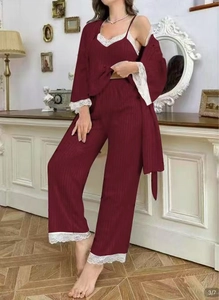 Detailed close-up of burgundy ribbed fabric and white eyelash lace trim on pajama set