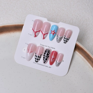 Detail view of 10pcs semi-handmade almond press-on nails with leopard and star patterns