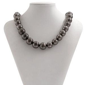 Close-up of chunky black CCB round bead necklace on a white neck model stand