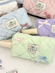 Pastel quilted cosmetic bags with bows in pink blue purple green and white colors