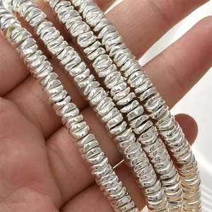 Stack of silver hematite faceted wave spacer beads for DIY jewelry making