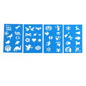 Detail of four blue plastic Halloween body paint stencils with festive patterns