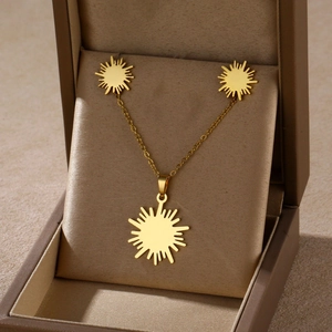 Golden sunburst necklace and earrings jewelry set in a luxury brown satin gift box
