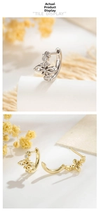 Detailed view of S925 silver cross earrings with zircon pavé in gold and silver finishes