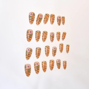 24pcs almond press-on nails with orange tiger stripes and 3D floral decorations