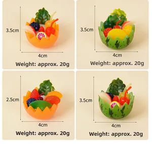 Detailed size view of miniature resin fruit bowl models with watermelon and orange designs