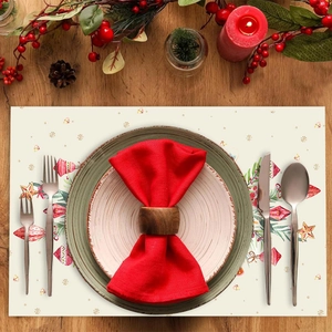 Christmas snowflake table mat with wooden napkin ring on rustic wooden table