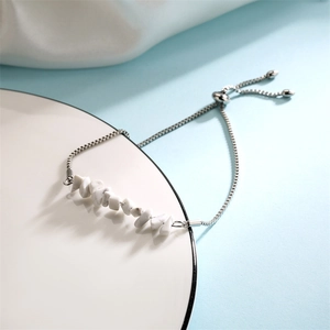 Detailed shot of white crushed stone bracelet with adjustable silver sliding clasp