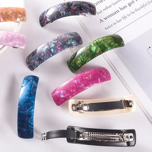 Detailed view of colorful acetate hair clips with durable metal spring clip mechanism