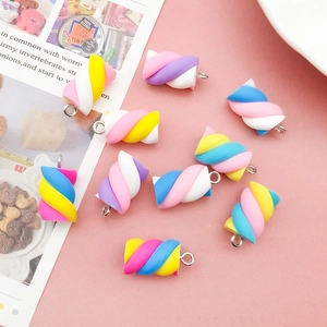 Macro detail of colorful resin marshmallow pendants with silver rings for DIY crafts