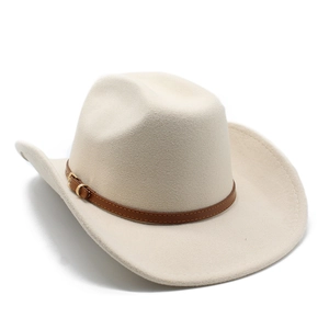 Detail of beige wool cowboy hat featuring a brown leather band and gold metal buckle