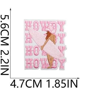 Size chart for pink surfer girl embroidery patch with Howdy text, 5.6cm by 4.7cm measurements