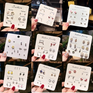 Detailed view of 7-day stud earring sets with heart and star shapes on jewelry cards