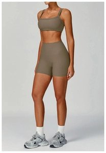 Detail of ribbed dark khaki yoga set showing fabric texture and square neck sports bra