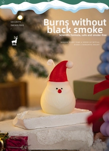 Detailed view of Santa Claus candle with red hat for festive Christmas home decoration