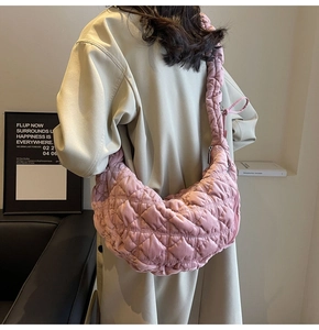 Pink quilted cloud shoulder bag with large capacity shown in a stylish lifestyle setting