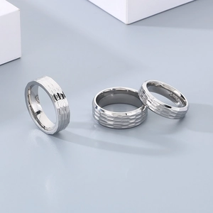 Macro detail of silver S925 rings with hammered texture and polished metal finish