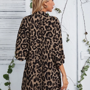 Detail of leopard print cardigan back view with lightweight fabric and loose sleeves