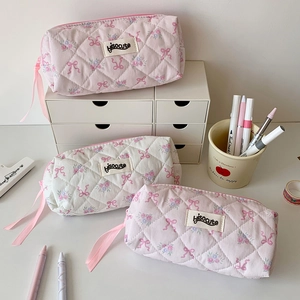 Pink quilted bow pencil case with vintage floral pattern and soft cotton texture