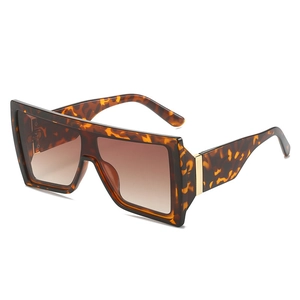 Modern oversized tortoiseshell sunglasses with gradient lenses and gold metal details