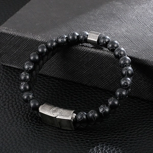 Detailed close-up of double-layer turquoise beads and leather cross bracelet for men