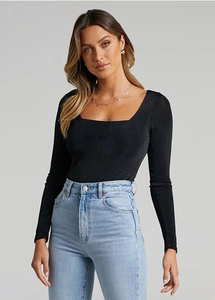 Detail of black square neck long sleeve ribbed knit yoga bodysuit top on fashion model