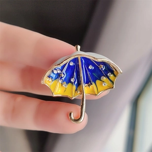 Starry sky umbrella brooch in gold metal with blue enamel, rhinestones and star patterns