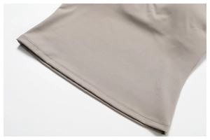 Detail of cross back yoga top showing precise double-needle stitching on smooth fabric