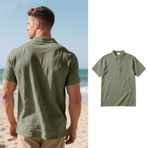 Detail view of sage green polo shirt featuring textured linen fabric and buttoned collar