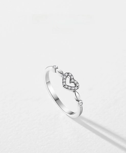 Macro shot of s925 silver heart ring with sparkling pave cubic zirconia accents