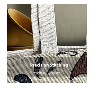 Detailed close-up showing reinforced stitching and durable canvas fabric on the tote bag