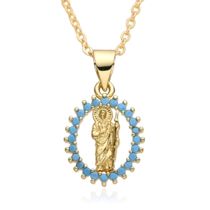 Macro view of gold religious icon pendant with vibrant blue beads and 18k plating