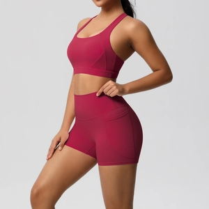 Detail view of high-waist berry workout shorts with practical side pocket for yoga